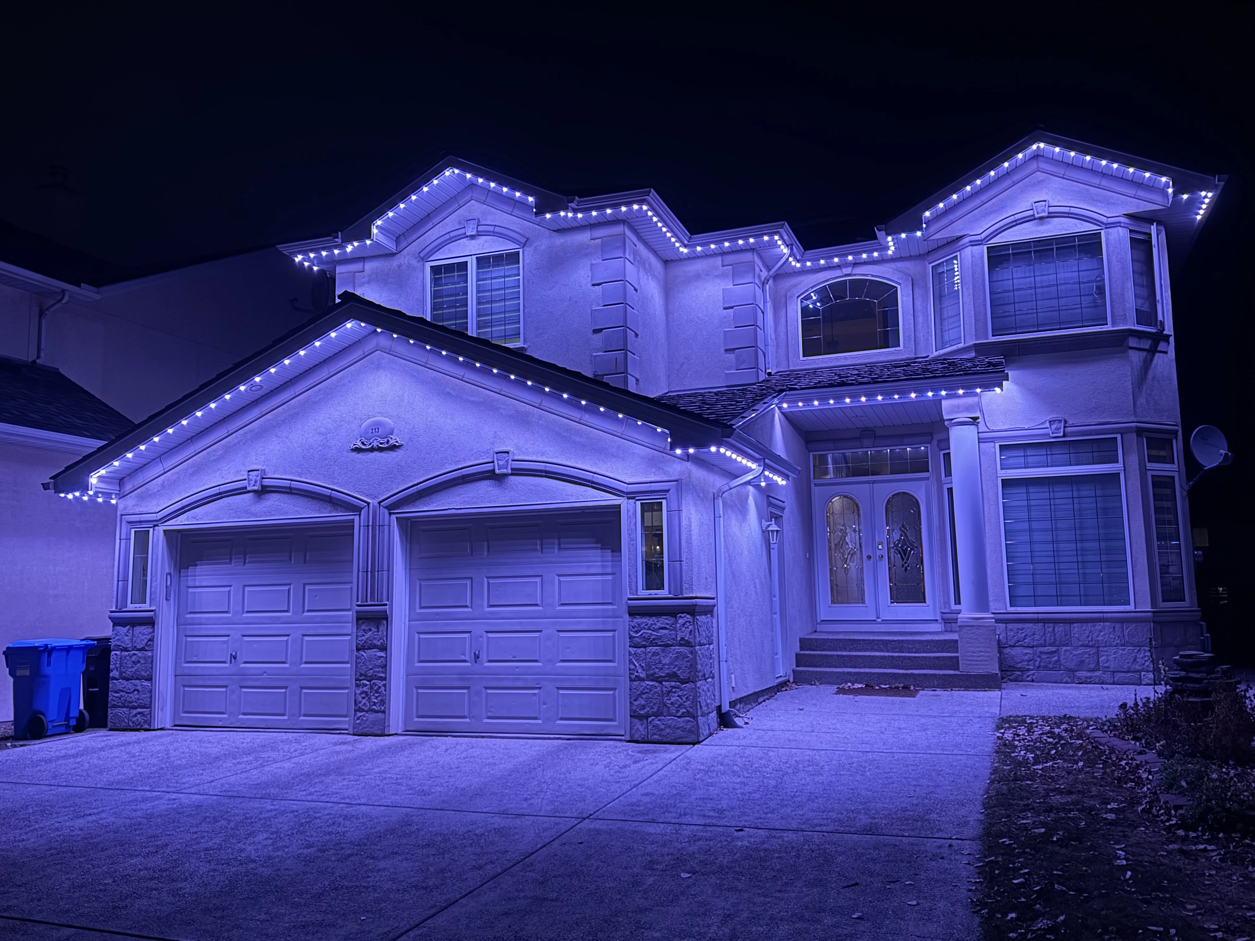 Permanent outdoor lighting installed on a Nanaimo home at night