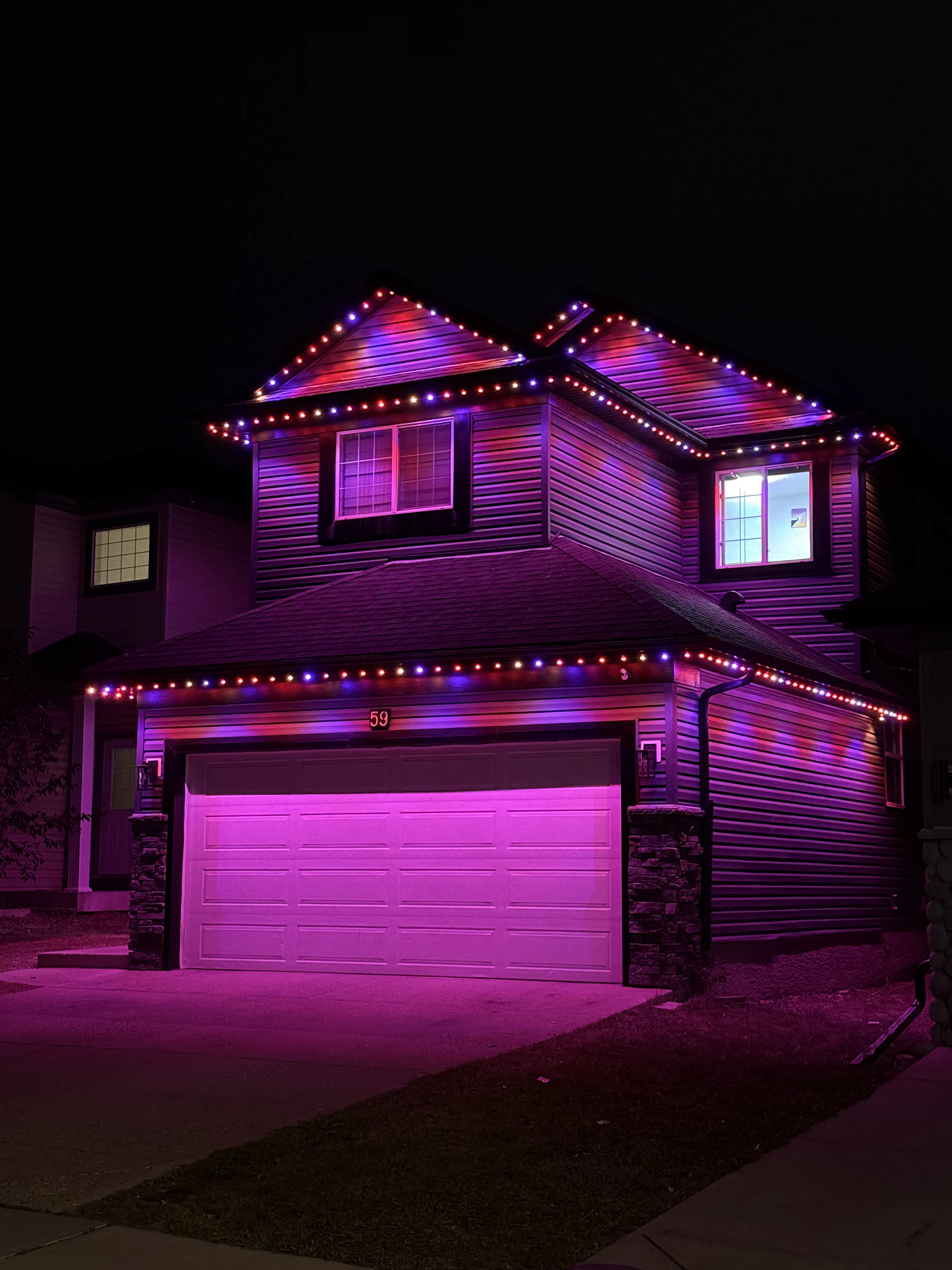 Permanent outdoor lighting installed on a Nanaimo home at night