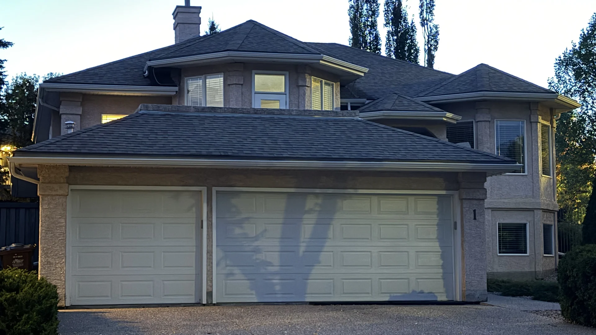 Front view of a home in daylight with no illuminated soffit lights or visible hanging bulbs along the eaves